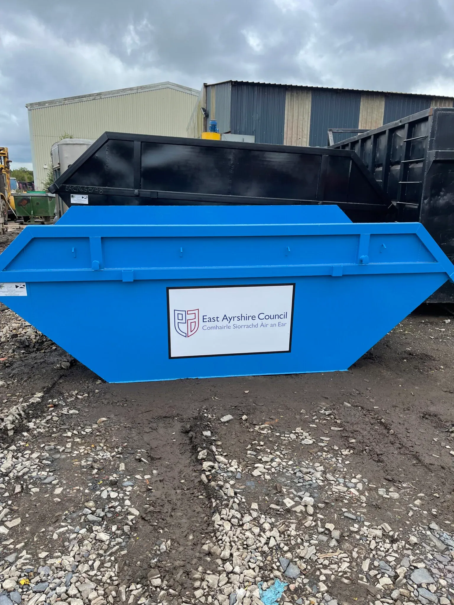 A refurbished builders' skip, repainted bright blue